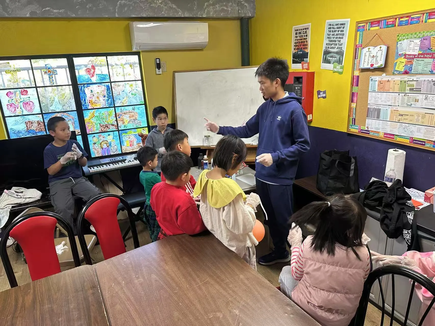 Larry Zhou demonstrates chemistry for students at Covina First Southern Baptist Church.